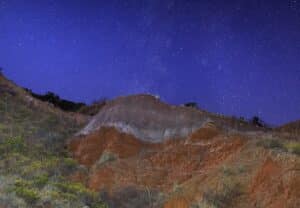 Star-filled night sky over the red rock canyon walls of Palo Duro Canyon, Texas